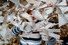 Volunteers weave winter camouflage nets for army in Zaporizhzhia